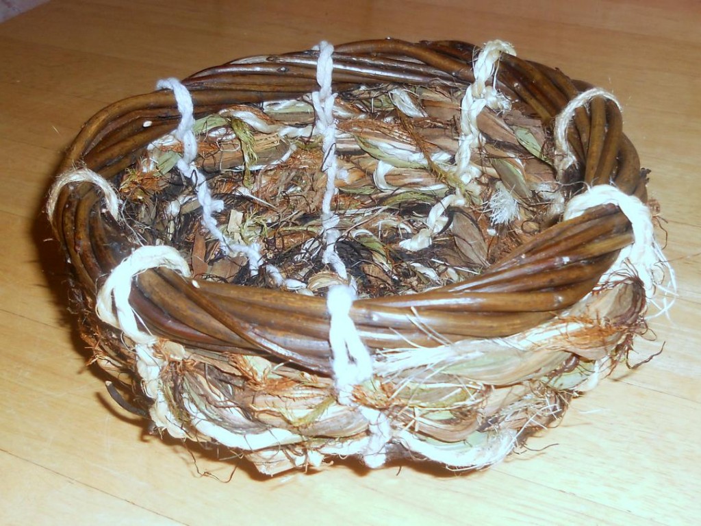 Coiled with rope made from montbretia leaves, seaweed, hair moss, string and leftover willow